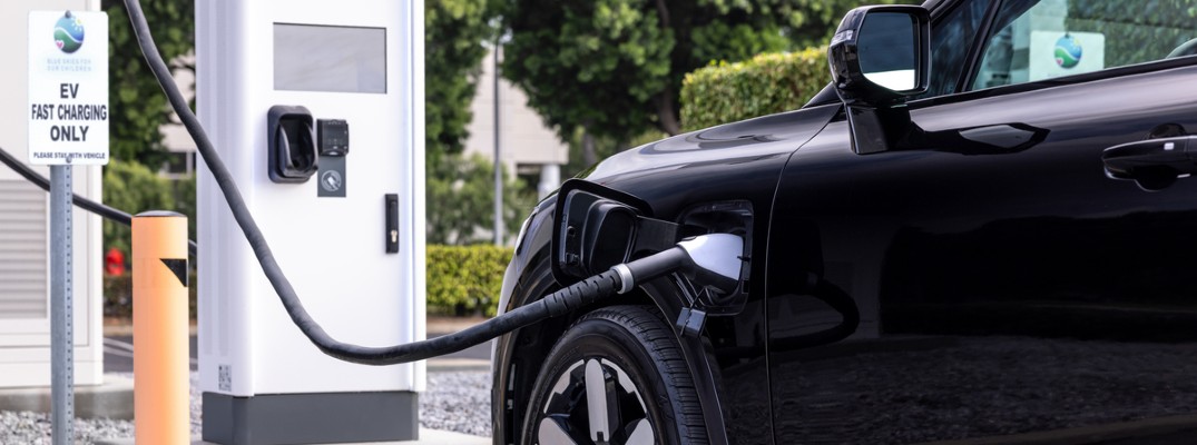 A Honda Prologue charging at a charging station.