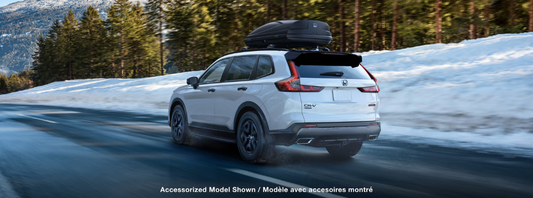 A 2026 Honda CR-V driving down a snowy road