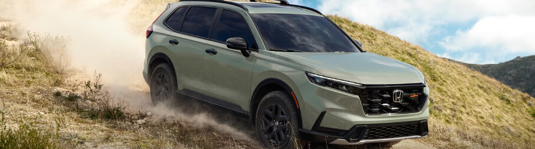 A 2026 Honda CR-V driving down a hill