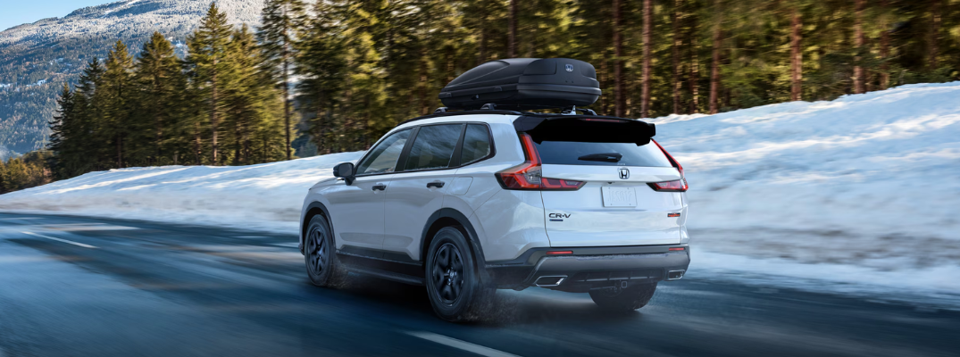The 2026 Honda CR-V driving down a snowy road