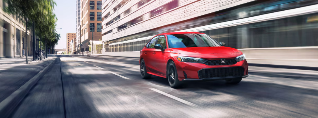 2026 Honda Civic driving down a city street