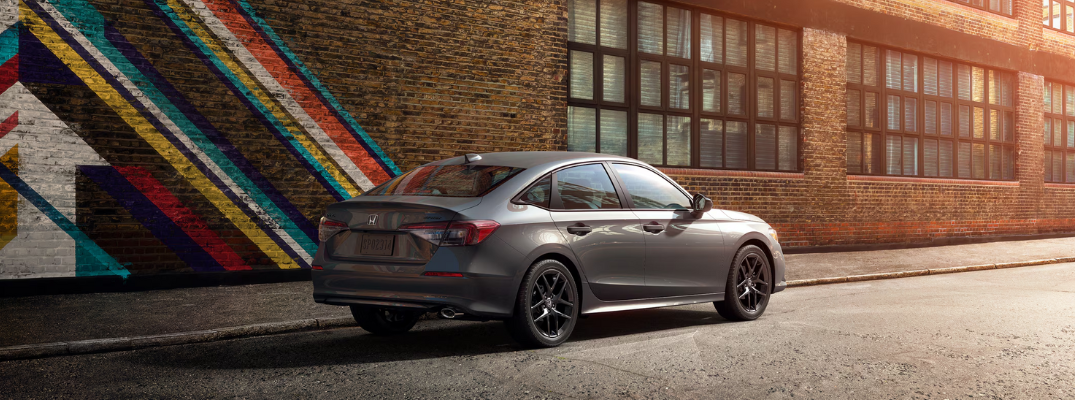 A Civic parked in front of a building