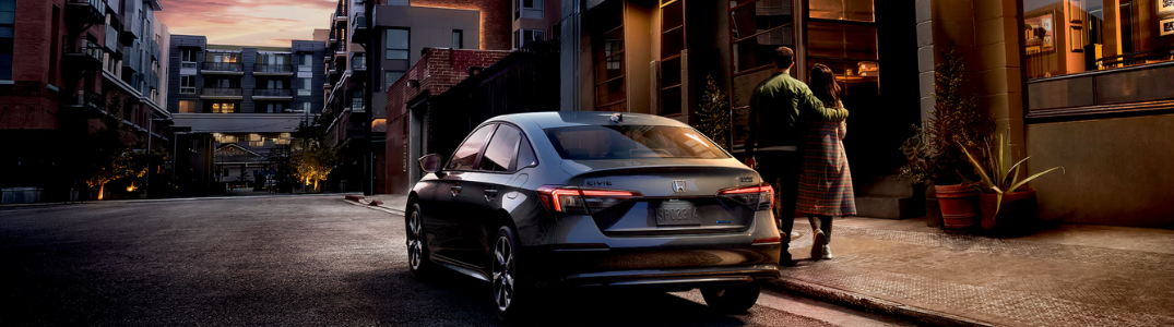 A Civic parked on a city street