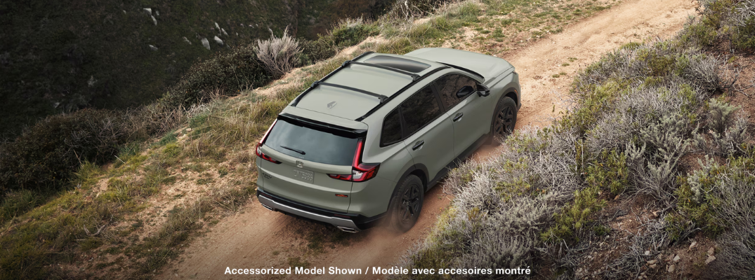 Honda CR-V Hybrid driving up a hill