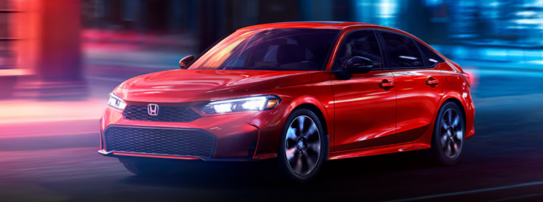 2026 Honda Civic driving in the city at night